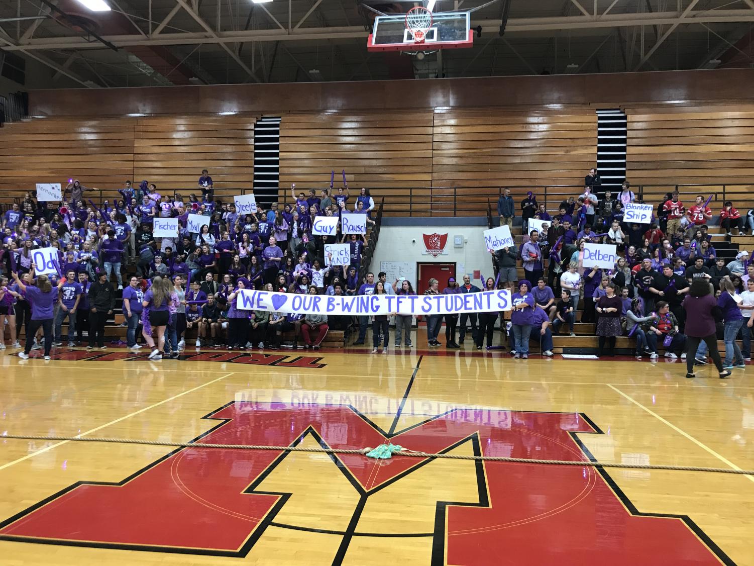 The B-wing purple team competes in a cheering contest during the assembly Sept. 27 for Trojan Pride Day. The wings competed in tug of war,